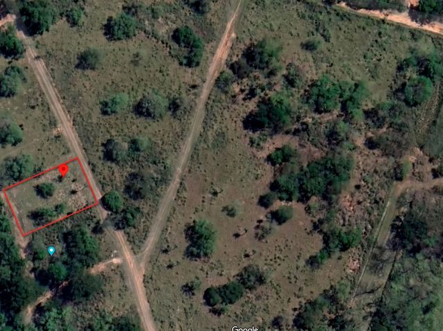 Satellite view with the lot boundary marked in red