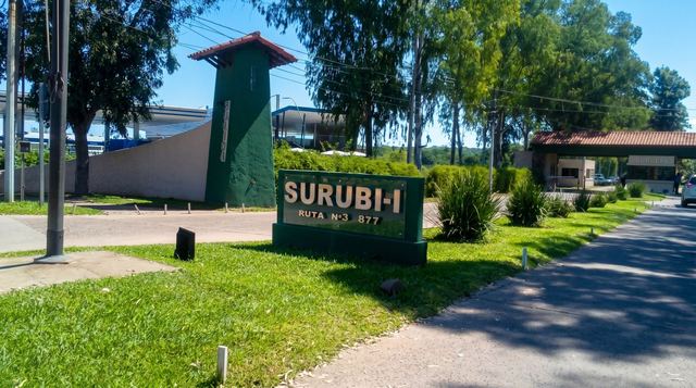Surubi-i entrance sign and guarded gate on Ruta 3